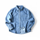 Obroi Blue denim shirt on a white background