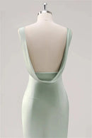 Mint green dress on a mannequin against a light gray background