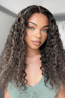Woman with long, wavy hair wearing a light green top, Obroi