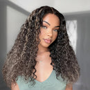 Woman with long, wavy hair wearing a green top against a neutral background, Obroi