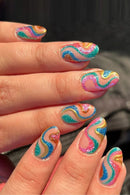 Multicolored wavy nail art on a hand with a blurred background, Obroi