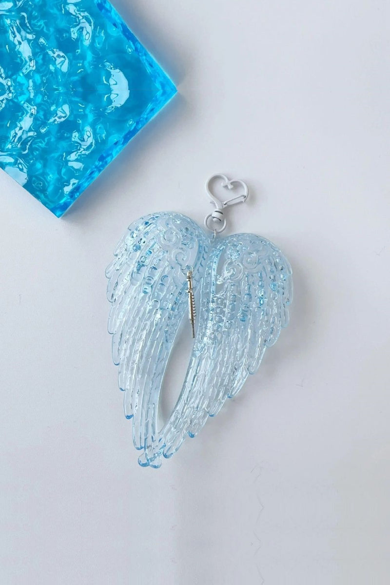 Obroi Blue angel wing pendant on a white background
