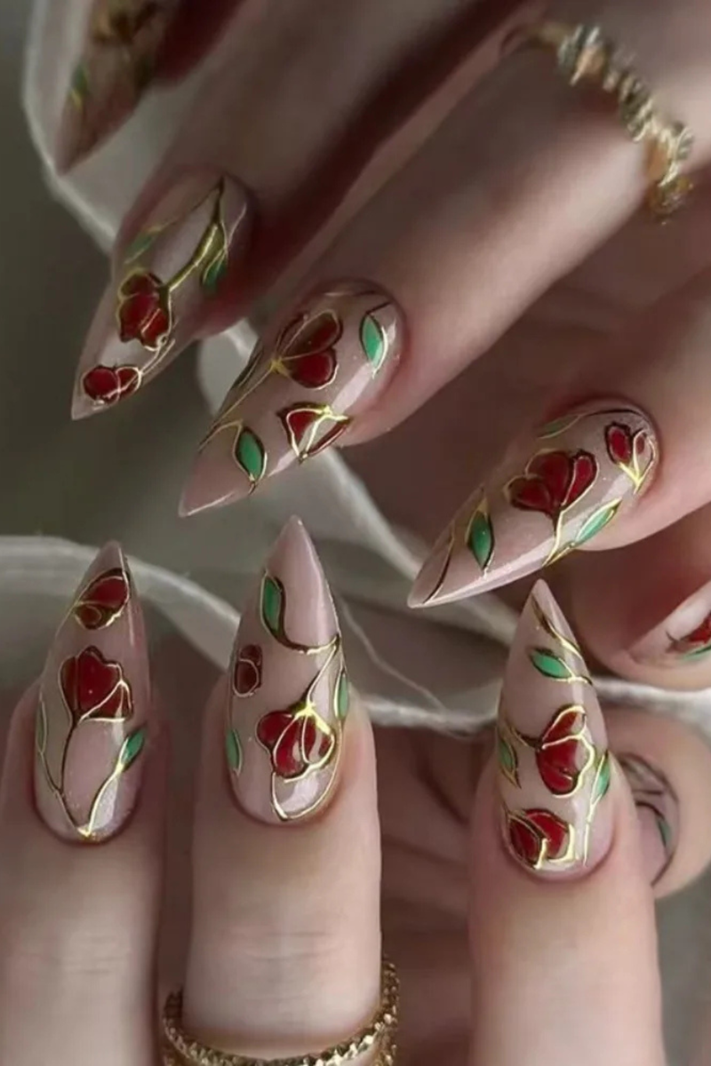 Nails with floral design featuring red flowers and gold accents,Obroi