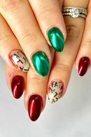 Obroi Close-up of hands with red and green nail polish on a light background