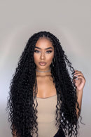 Woman with long curly hair and a close-up of a black braided hair extension, Obroi