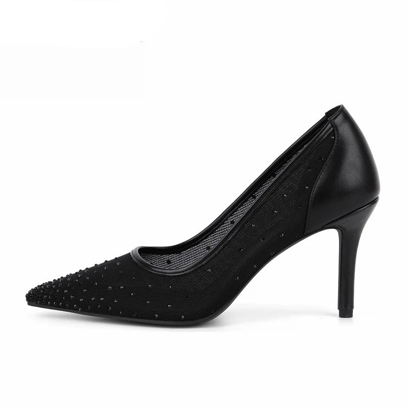 Black high-heeled shoe with studded details on a white background, featuring the brand 'Obroi'.