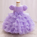 Lavender dress with ruffles and a bow on a mannequin against a white background, Obroi