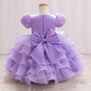 Lavender dress with a large bow on a mannequin against a light background, Obroi