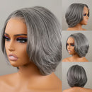 A layered bob wig in a salt and pepper gray color, shown on a mannequin head from multiple angles including a large side profile, a three-quarter face view, a three-quarter back view, and a rear view. An orange text banner at the bottom reads 'Pre-Sale Salt and Pepper Layered Bob Wig', Obroi