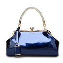 Blue handbag with gold accents on a white background, Obroi