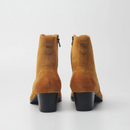 Pair of brown suede ankle boots on a white background, Obroi