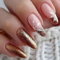 Nails with gold and white design on a blurred background, Obroi