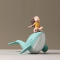 Decorative figurine of a child on a whale with measurements indicated, Obroi