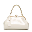 White handbag with gold accents on a white background, Obroi