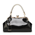 Black handbag with gold accents on a white background, Obroi
