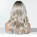 Long wavy wig with a silver and ash blonde balayage look, shown from the back on a mannequin head against a white background, Obroi