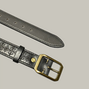 Black leather belt with gold buckle on a gray background, Obroi