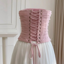 Pink corset with white skirt against a neutral background, Obroi