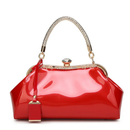 Red handbag with gold accents on a white background, Obroi
