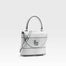 Silver handbag with a cat emblem on a white background, featuring the brand 'Obroi'.