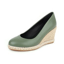 Green wedge shoe with a textured sole on a white background, Obroi