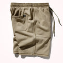 Beige shorts with an elastic waistband and drawstring on a white background, Obroi