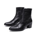 Black leather ankle boots with a block heel on a white background, featuring the brand 'Obroi'.