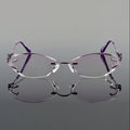 Pair of rimless eyeglasses with purple arms on a gray background, featuring the Obroi brand.