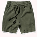 Green shorts with drawstring on a white background, Obroi