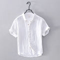 White short-sleeve shirt on a hanger against a gray background, Obroi