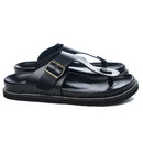 Black sandal with a gold buckle on a white background, Obroi