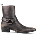 A dark brown distressed leather ankle boot with a buckle strap detail on the side, set against a plain white background, Obroi