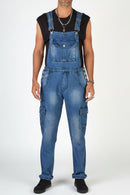 Person wearing blue denim overalls on a white background with 'Obroi' branding.