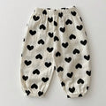 White pants with black heart patterns on a light gray background, Obroi