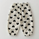 White pants with black heart patterns on a light gray background, Obroi