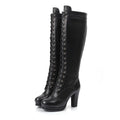 Black knee-high boots with lace-up design on a white background, Obroi