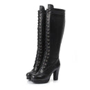 Black knee-high boots with lace-up design on a white background, Obroi