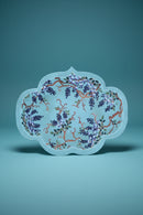 Decorative plate with floral design on a light blue background, Obroi