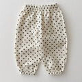 Polka dot baby pants on a light gray background, Obroi