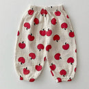 Children's pants with red apple pattern on a light gray background, Obroi
