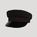 Black cap with red embroidery on a light gray background, Obroi