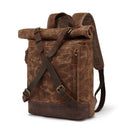 Brown leather backpack with rolled top on a white background, Obroi