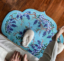 Decorative rug with floral pattern on a wooden floor, Obroi