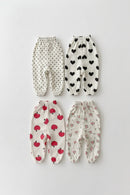 Four pairs of baby bloomers with different patterns on a light gray background, Obroi