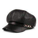 Black leather cap with a gold chain on a white background, Obroi