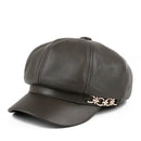 Dark gray leather cap with gold emblem on a white background, Obroi