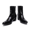 Black patent leather ankle boots with crocodile texture on a white background, branded 'Obroi'.