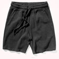 Dark gray shorts with a drawstring on a white background, Obroi