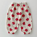 Children's pants with red apple pattern on a light gray background, Obroi