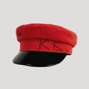 Red cap with black visor on a light gray background, Obroi